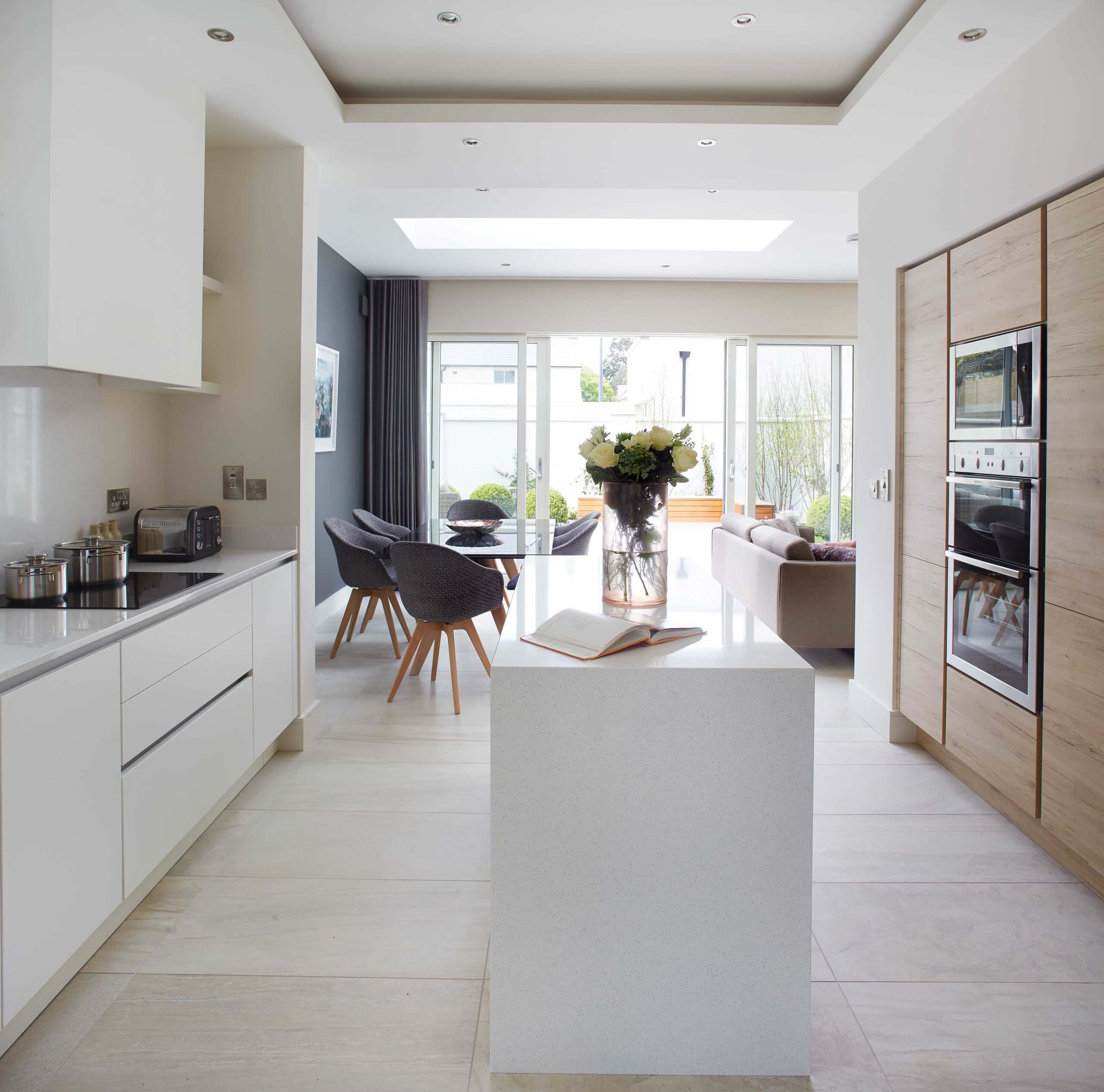 To maximise reflected light, opt for light and reflective materials or colours. Choosing lighter and brighter floor surfaces like pale timbers or floor tiles can make a significant difference. In the kitchen, go for bright countertops that enhance the overall brightness.